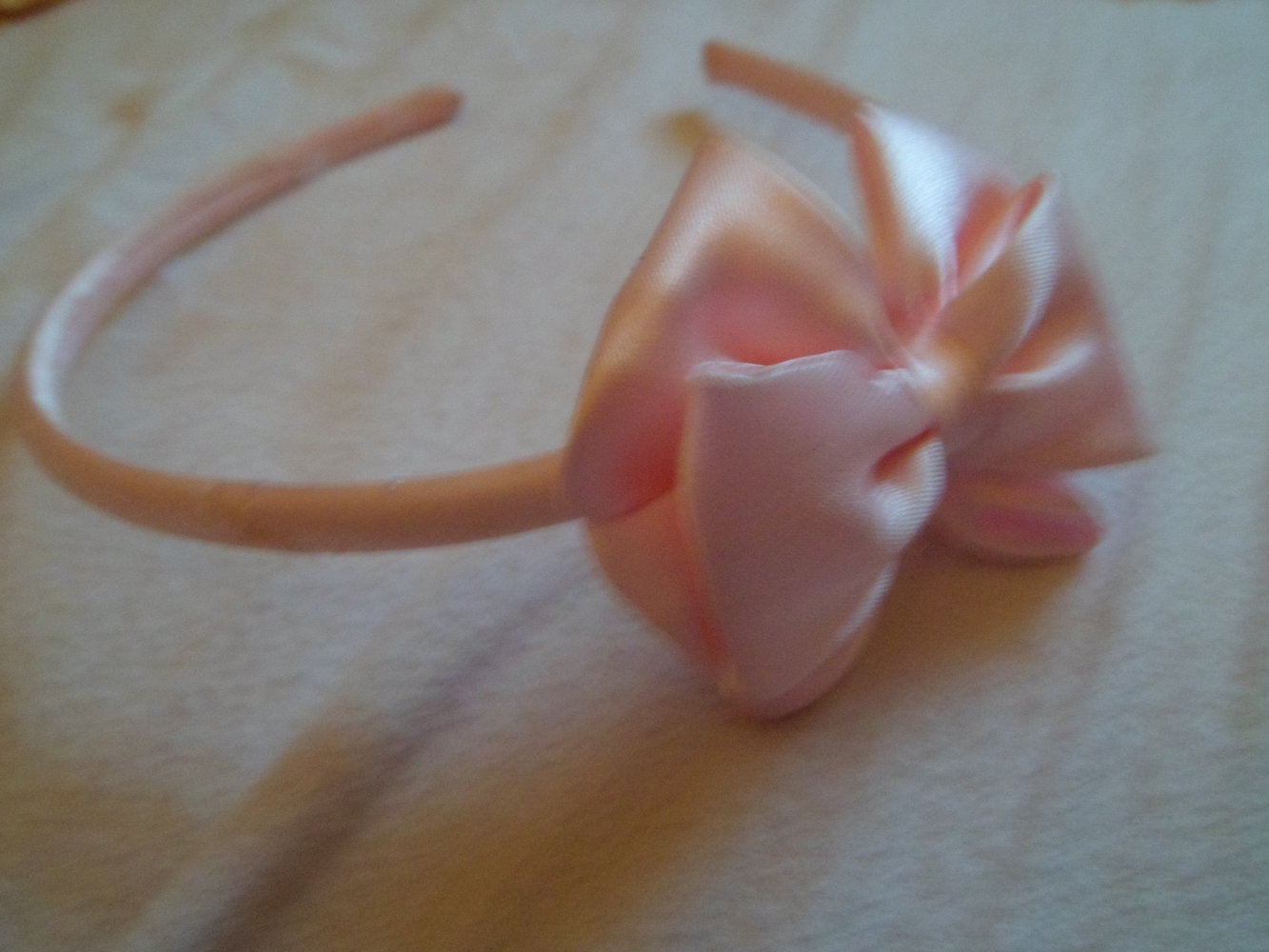 Rosa Haarreif mit Schleife