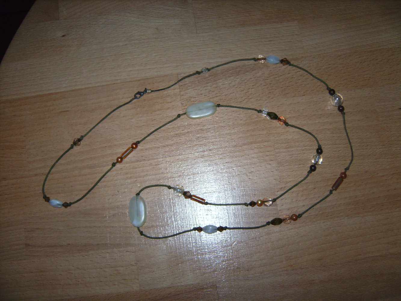 Verschenke Kette Modeschmuck Perlen Kunststoff rostbraun mandarine lang, Boho, Steinoptik an Knüpfband zu Warenkauf