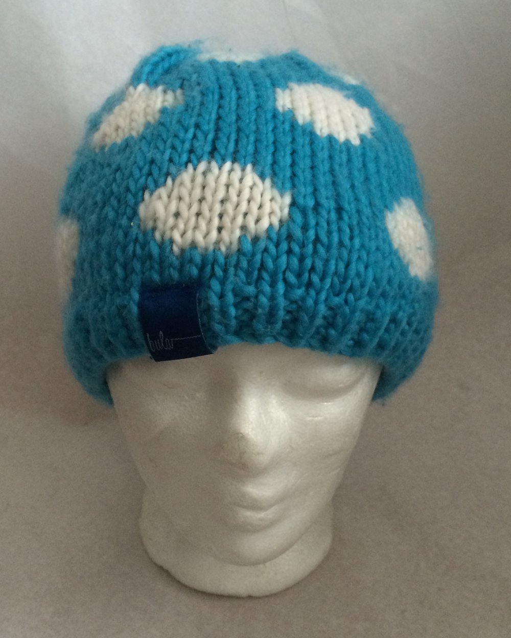 Warme Fleecestirnband Mütze in Turkis-blau mit weissen Punkten, 