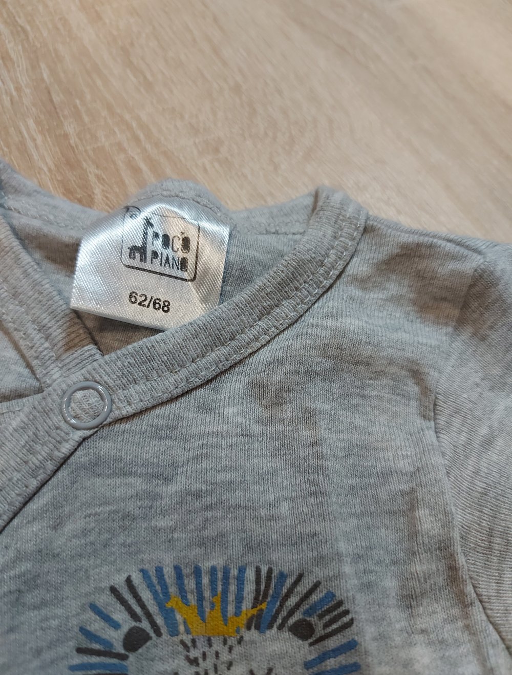 Grau mellierter Langarmbody Größe 62/68 Pocopiano