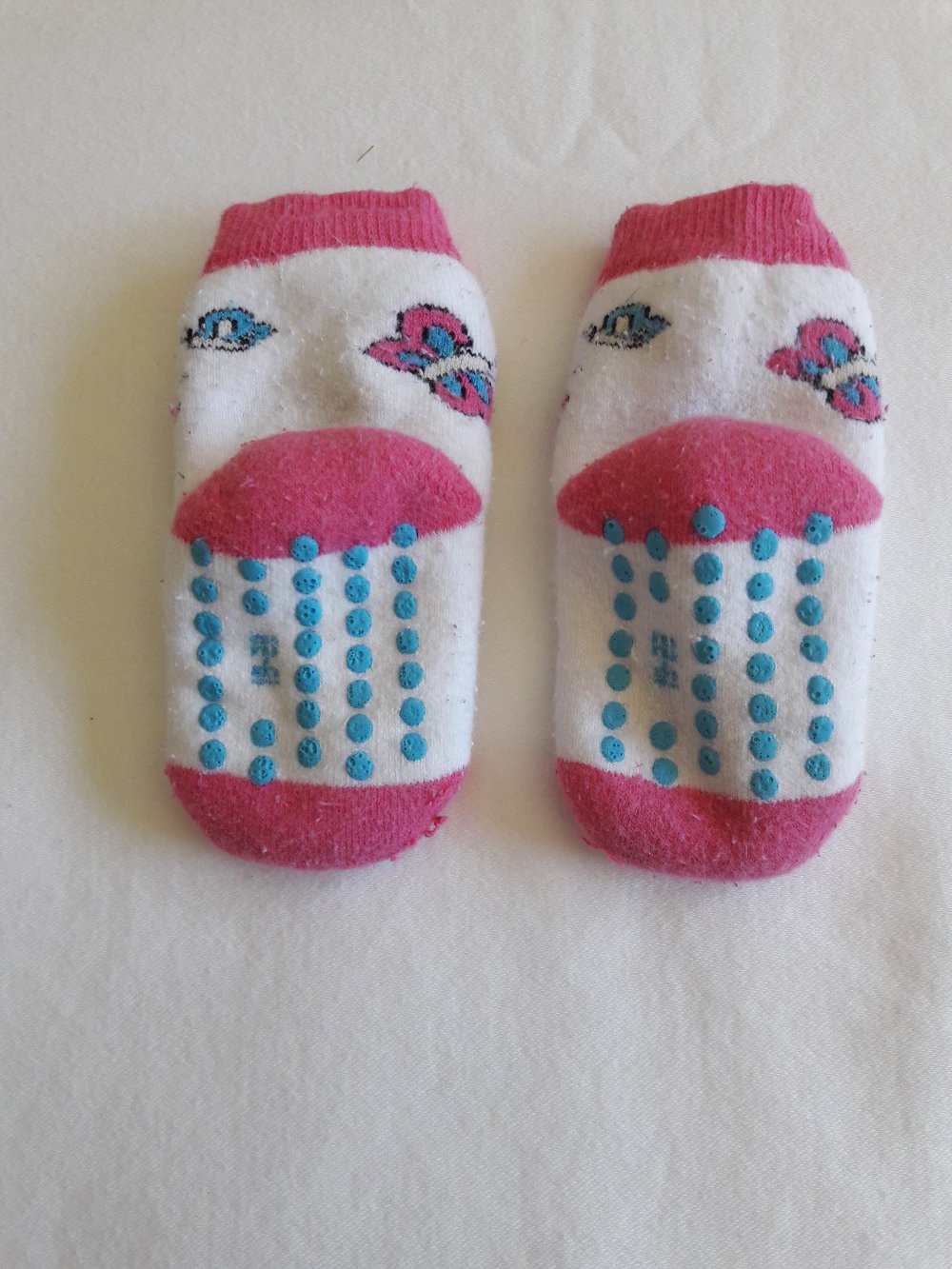 Stoppersocken, pink/weiß mit Schmetterlingen, Gr. 19-22