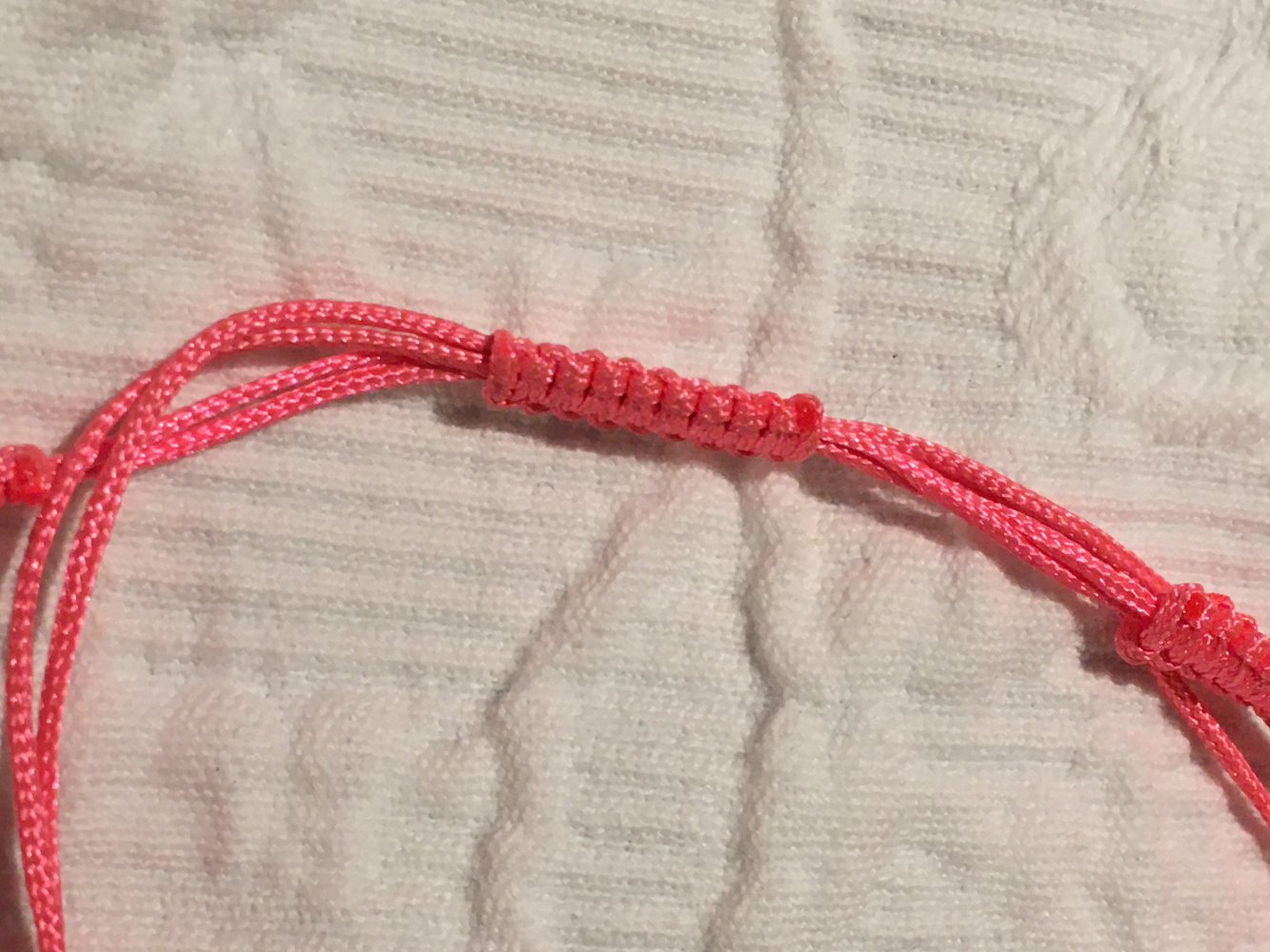 Armband geflochten neon pink Infinity Glitzer, größenverstellbar, Freundschaftsarmband