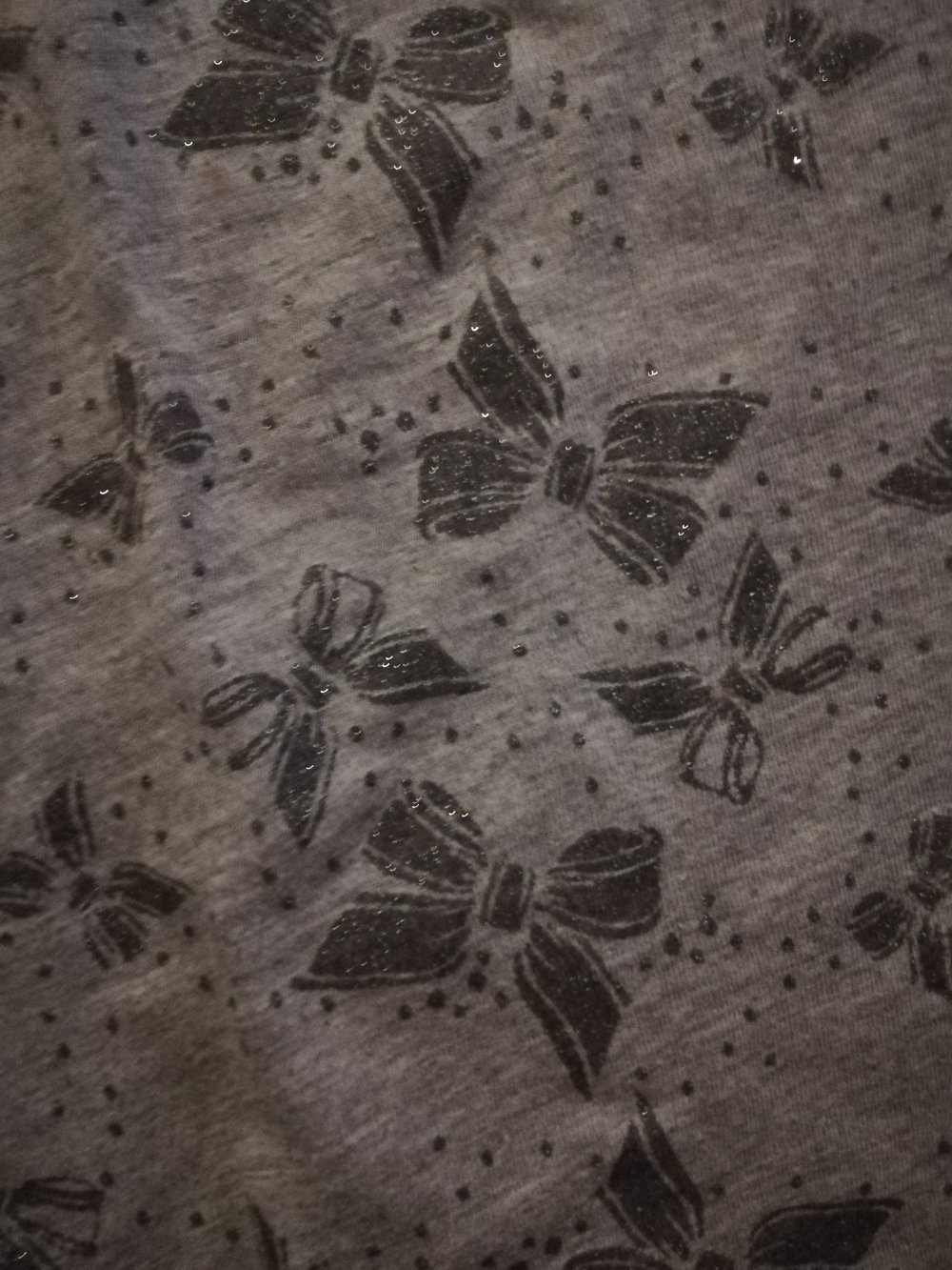 Graues Shirt von H&M mit glitzernden Schleifen, Gr. 36