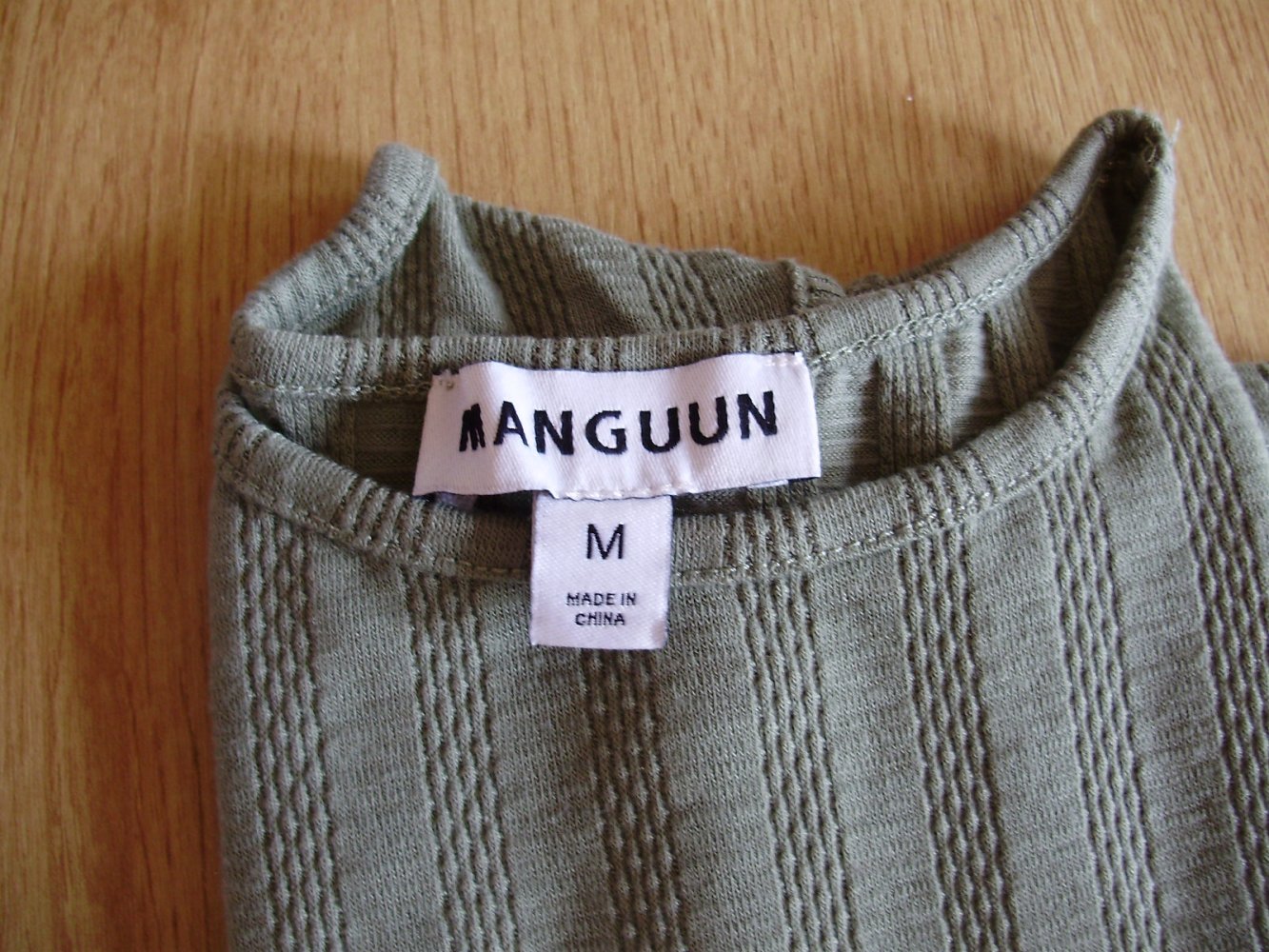 Manguun Top ausgefallen M S