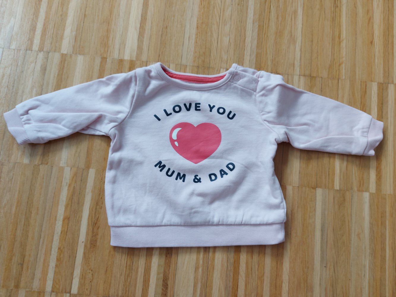 rosafarbener Babypullover/Longsleeve 