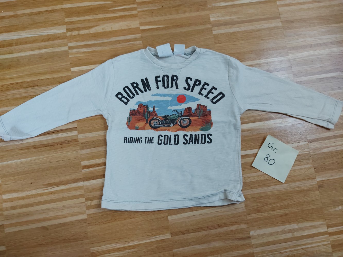 langärmliger cremeweißer Babypullover Born for Speed Gr. 80