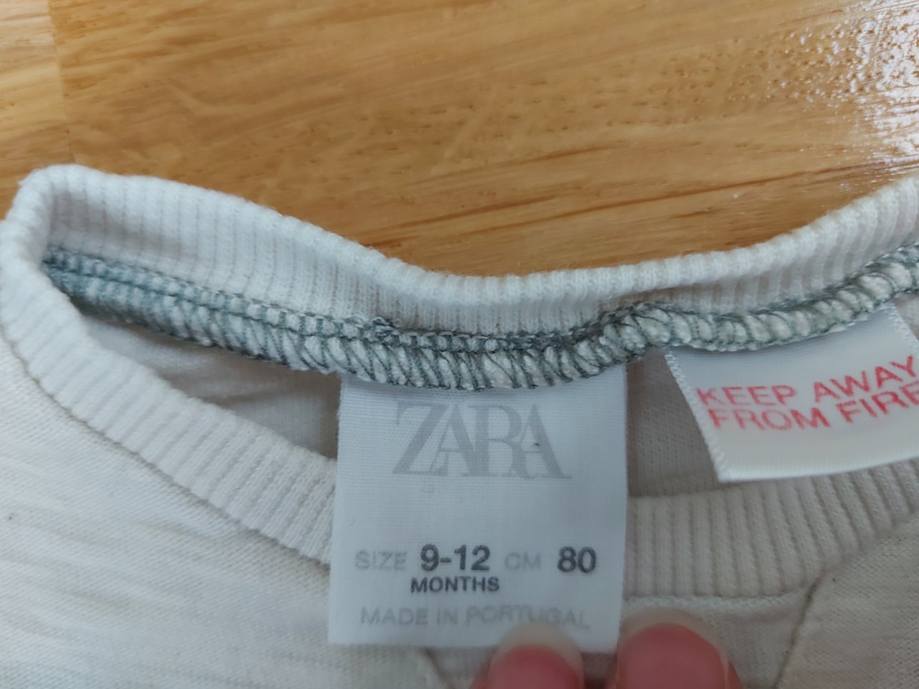 langärmliger cremeweißer Babypullover Born for Speed Gr. 80