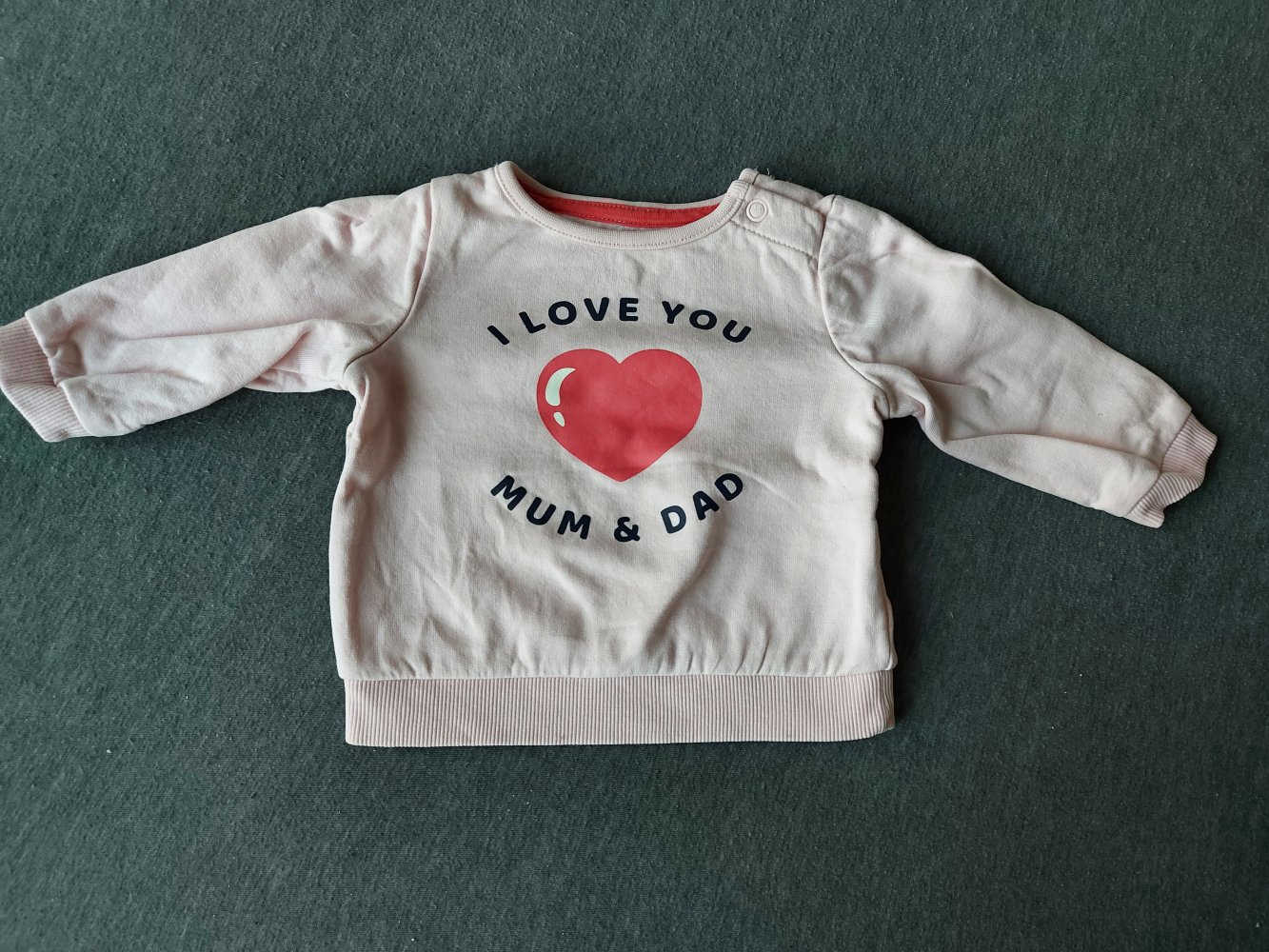 rosafarbener Babypullover/Longsleeve 