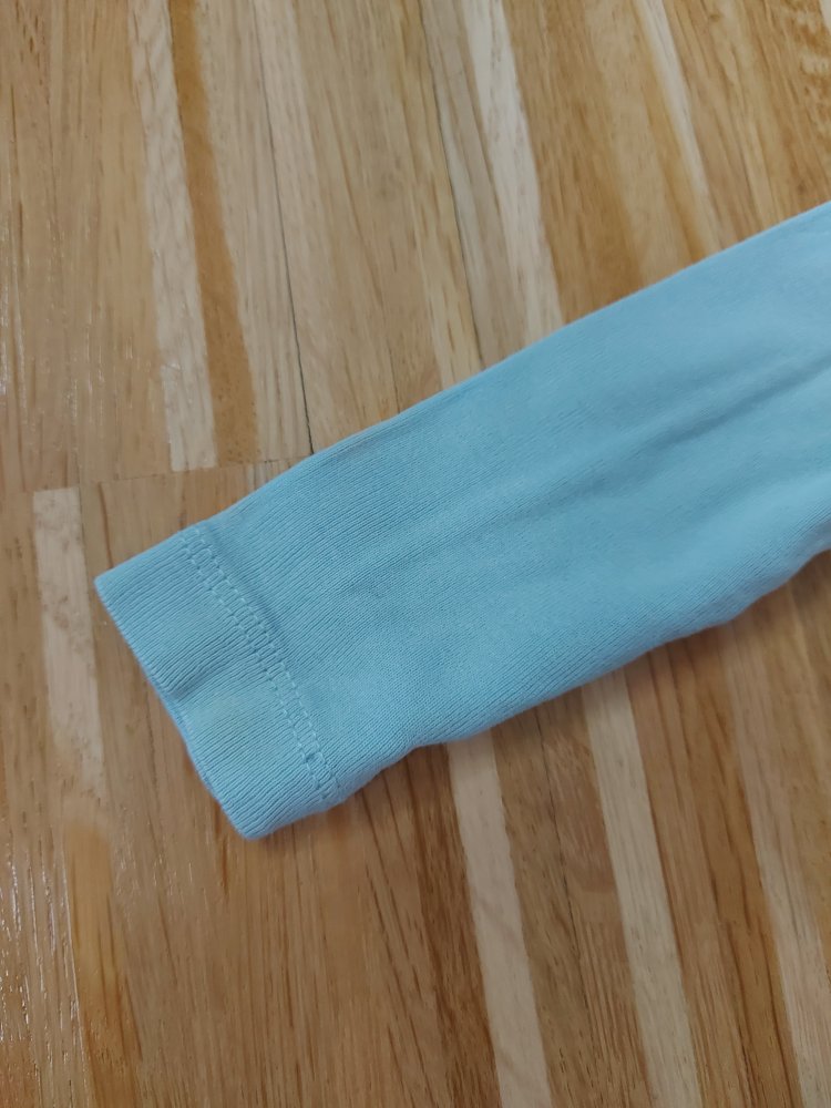 Langärmliger türkisblauer Babybody mit Traumfänger 