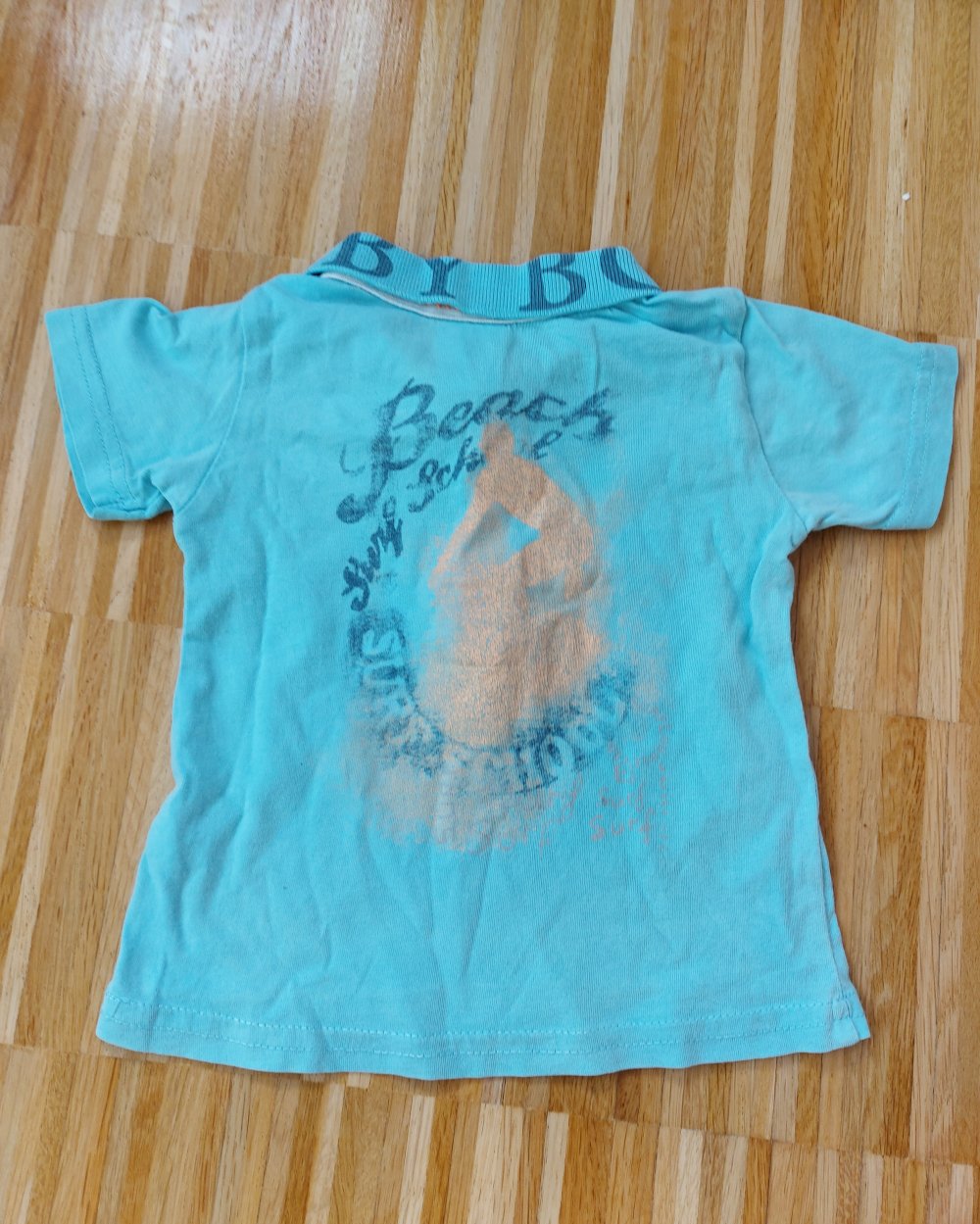 kurzärmliges hellblaues Baby-Poloshirt Gr. 74