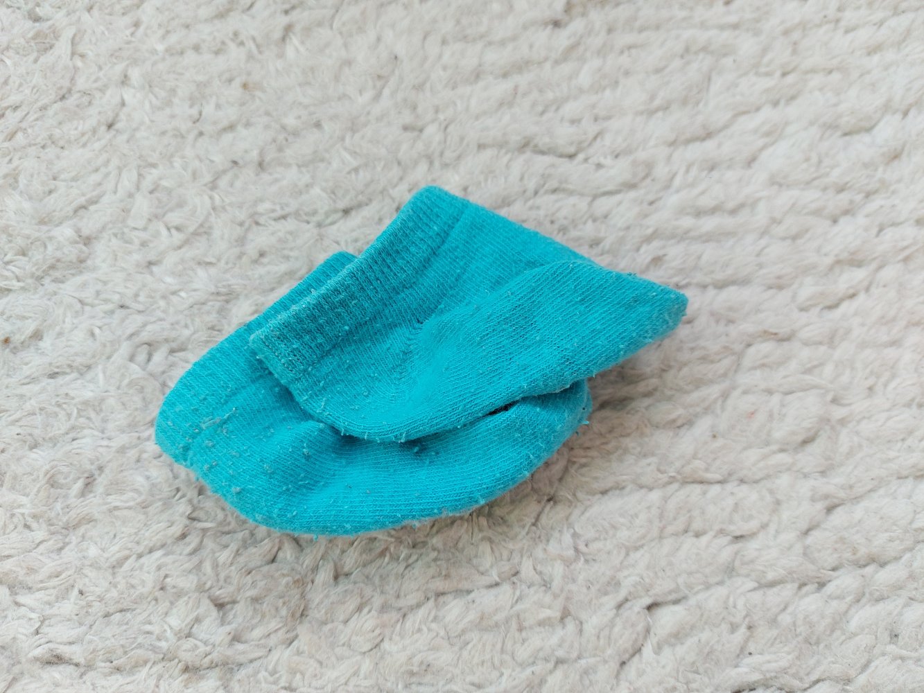 türkisfarbene Erstlingssöckchen / Babysocken